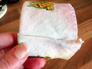 Stitched fabric end folded.